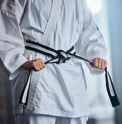 Karate, fitness and fighter with martial arts in the gym, sports motivation with black belt and defense training. Health, wellness and exercise with taekwondo and strong, power and active.