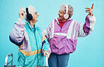 Friends, city and senior women with headphones on blue background wall listening to audio, music and radio. Fashion, style and elderly females enjoy retirement, freedom and dancing in urban town