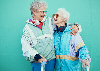 Buy stock photo Friends, funky and retirement with a senior woman pair outdoor together on a green wall background. Happy, trendy and fashion with a mature female and friend bonding outside for fun or lifestyle