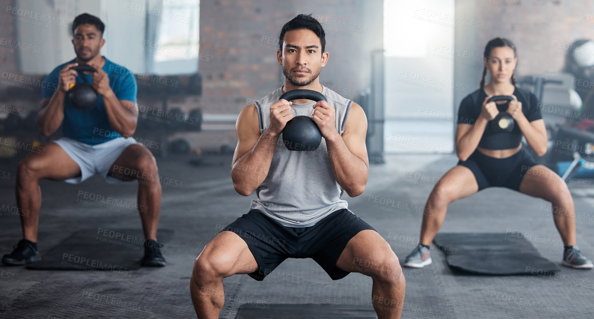 Buy stock photo Fitness, workout and kettlebell with a personal trainer in class with a group of students for exercise. Portrait, gym and strong with a coach weight training a man and woman athlete in a sports club