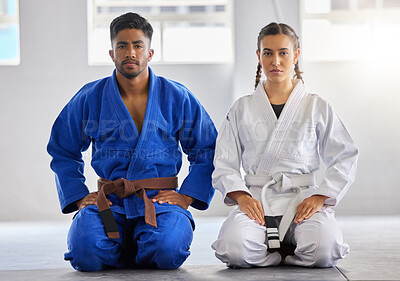 Buy stock photo Karate, man and woman in portrait together with focus determination for fitness, wellness or training. Couple, martial arts and sitting knees in gym, dojo or club for exercise, fight sport or workout