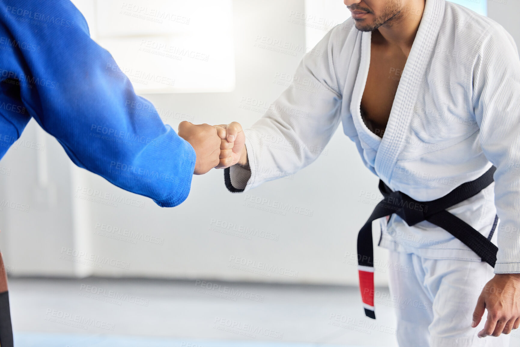 Buy stock photo Karate, fighting tournament and men fist bump in martial arts competition for fighters with sportsmanship, honor and discipline. Man, judo fighters and self defense fight to win in dojo with respect 