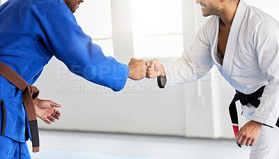 Buy stock photo Men in karate club, training focus and fist bump for competition fight in Japan. People greeting, learning martial arts fitness and healthy lifestyle in mma sports center with champion athletes