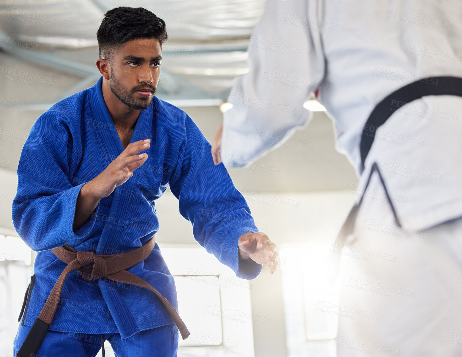 Buy stock photo Martial arts, karate and student learning safety or self defense from a taekwondo expert or master in a dojo. Focus, fitness and fighting instructor coaching, teaching or fighting a healthy man
