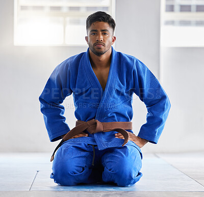 Buy stock photo Karate, training and portrait of a coach ready for martial arts, fight and self defense sport at a gym. Fitness, focus and man in a uniform with a brown belt in taekwondo at a studio for sports