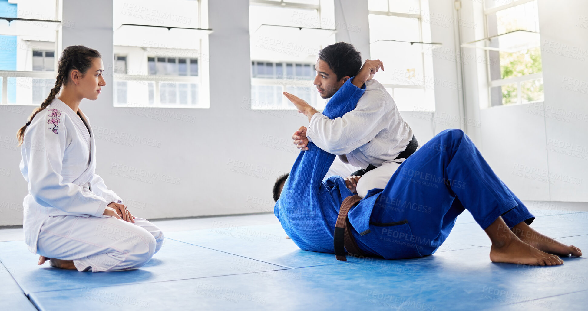 Buy stock photo Karate, fitness and student learning from a teacher in a fighting workout, mma training or combat exercise. Sports, education and martial arts expert instructor coaching or teaching a girl or woman