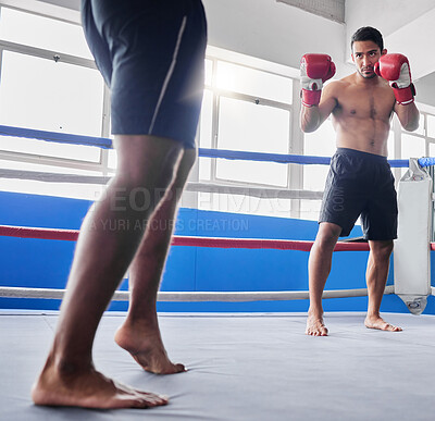 Buy stock photo Boxing, sports and fight with a man athlete in the ring with a rival for competition in a sport club. Gym, fitness and exercise with a male fighter and coach training in a health facility together