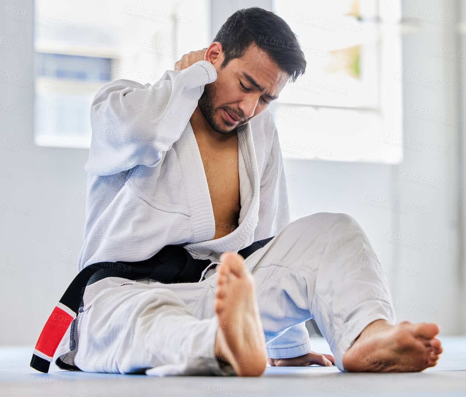 Buy stock photo Karate, sports injury and neck pain of man at fitness club for martial arts, exercise and training to fight for competition. Athlete male tired after taekwondo, sport and training with health problem