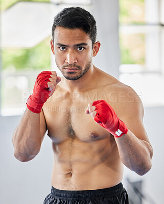 Buy stock photo Fight, fist and kickboxing athlete man looking serious, angry and ready for martial arts exercise, training and competition. Asian sports or Muay thai model portrait for train session at ftness gym