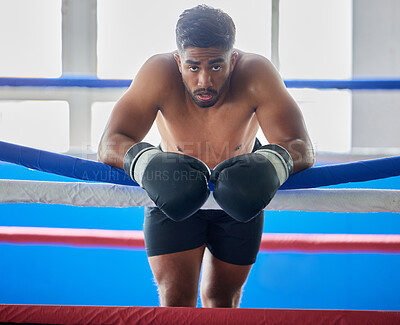 Buy stock photo Boxing ring, man and tired from fight, training and workout in gym exercise, burnout and fail in competition games. Portrait sweating boxer, athlete and guy, break and breathing in sports arena club 