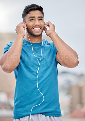 Buy stock photo Man, music and earphones for city exercise for wellness, training and running by blurred background. Happy runner, listening and streaming on internet, web or app to relax at workout in urban metro