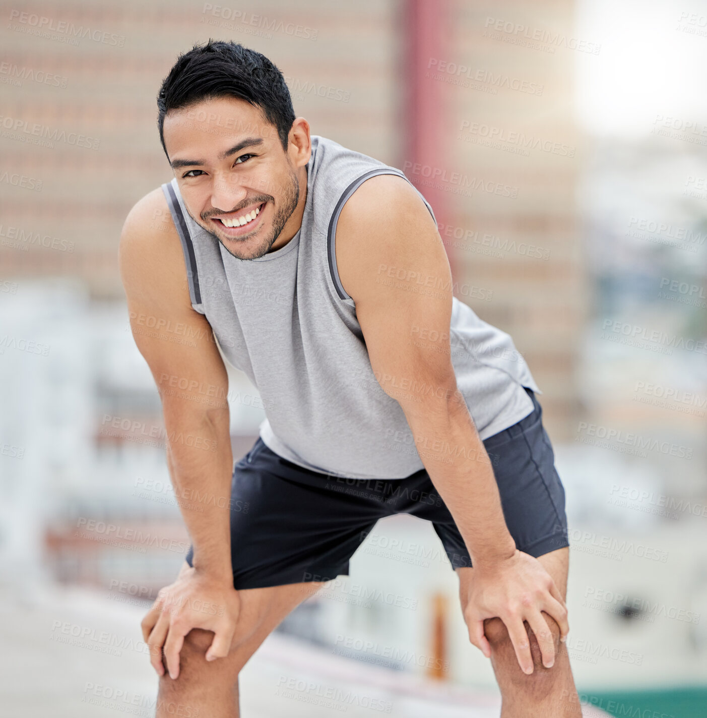 Buy stock photo Tired, fitness and man rest on roof in city after outdoor sports workout, health motivation and training outside. Blurred cityscape background, urban athlete and personal trainer rest after exercise 