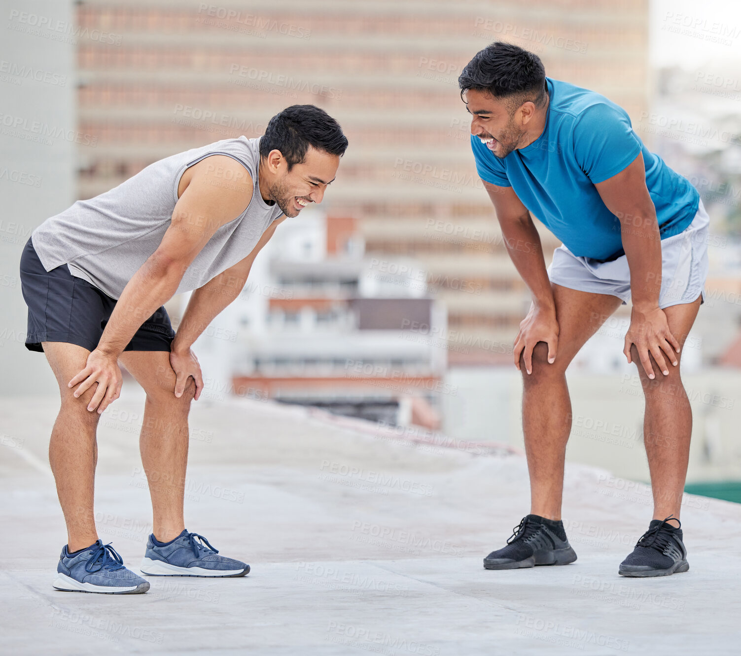 Buy stock photo Fitness, exercise and friends talking on rooftop, comic joke and laughing together. Healthcare, happy and communication or discussion of men outdoors in city with smile after training for wellness.