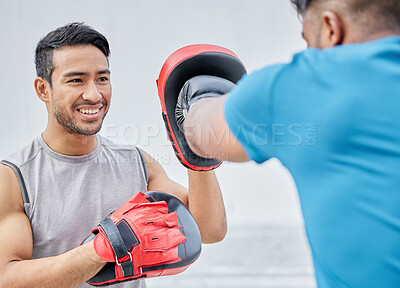 Personal trainer, man boxer and training for boxing match, cardio fighting workout and punching exercise. Fitness coach, sports motivation and men learning to fight for completion tournament outdoors