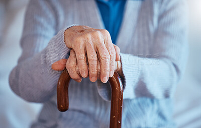 Buy stock photo Hands, cane and disability with a senior woman closeup in her home alone with a walking stick for mobility. Health, medical and wellness with a mature female in a retirement home with hand wrinkles