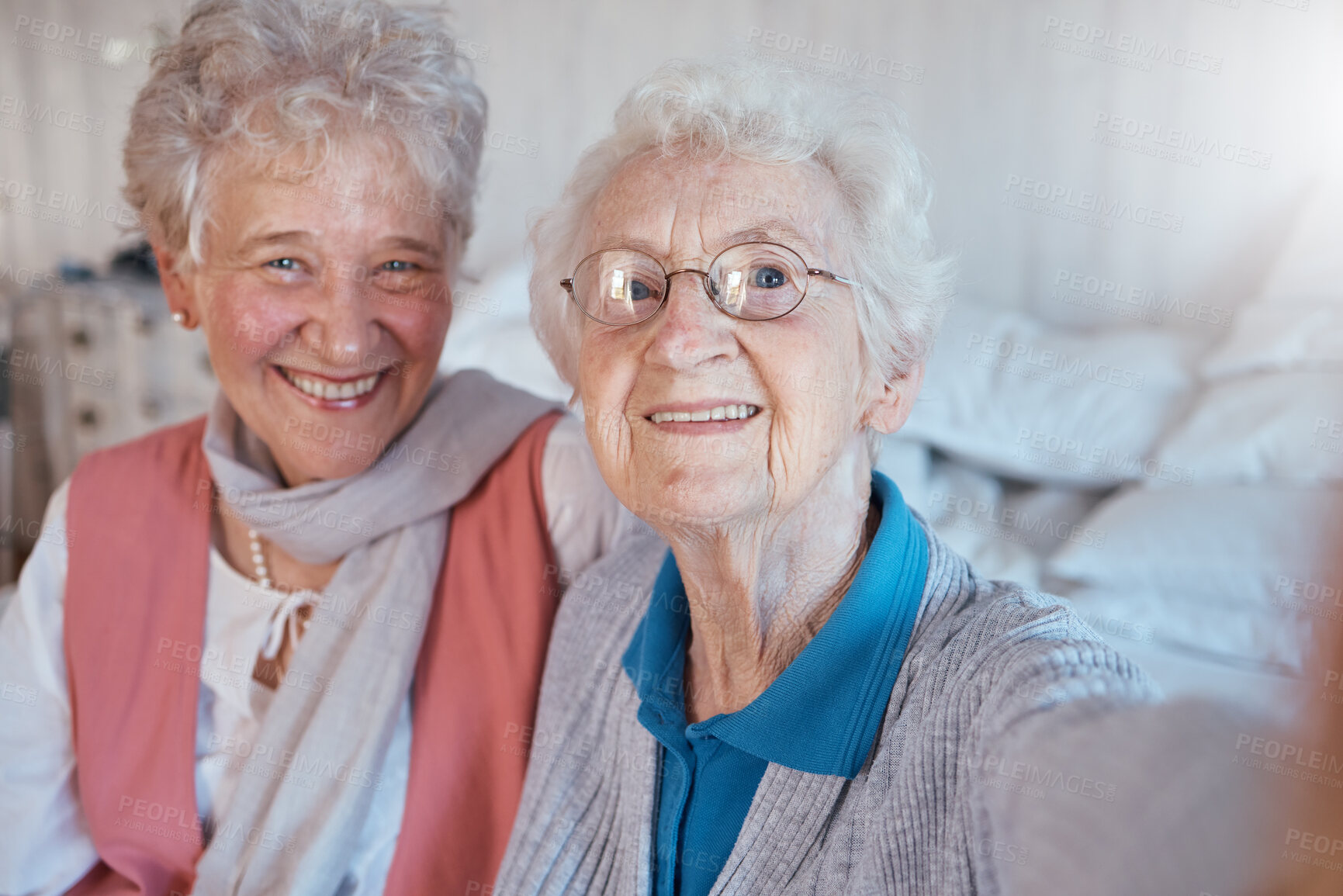 Buy stock photo Senior women, friends and selfie with a smile, happiness and care during a visit or lifestyle in a nursing home together. Face portrait of old people happy about retirement, support and trust