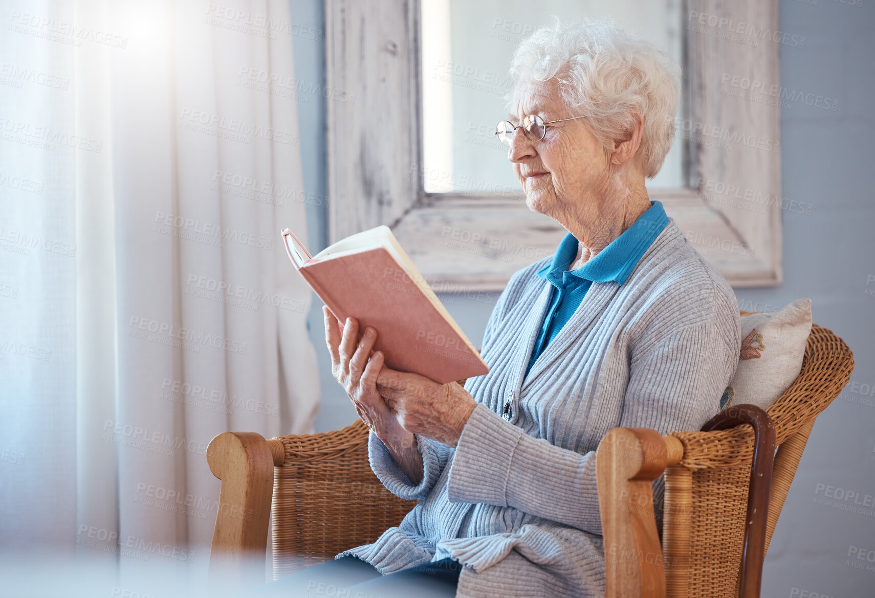 Buy stock photo Book, reading and senior woman in home retirement with glasses and calm mindset, knowledge and learning on sofa chair. Elderly or old woman with literature, language and love story in her living room