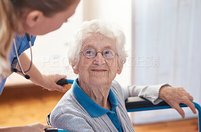 Buy stock photo Disability, nursing and senior woman with a doctor for care, consultation and medical help at a hospital. Healthcare, communication and elderly patient in a wheelchair with a nurse in a home