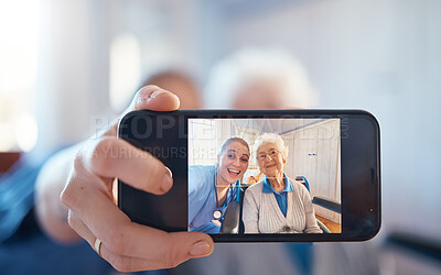 Buy stock photo Phone, nurse and happy old woman take a selfie on screen after consulting with medical doctor. Photo, caregiver and healthy senior person in retirement take pictures for social media in nursing home