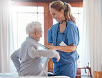 Nurse, healthcare and senior woman in nursing home with physician helping her dress up. Disability, rehabilitation and female medical worker with retired patient in home with care, empathy or support