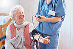 Doctor, senior patient and blood pressure healthcare consulting in a retirement home. Medical support, professional caregiver and cardiology health consultation for elderly person in nursing home