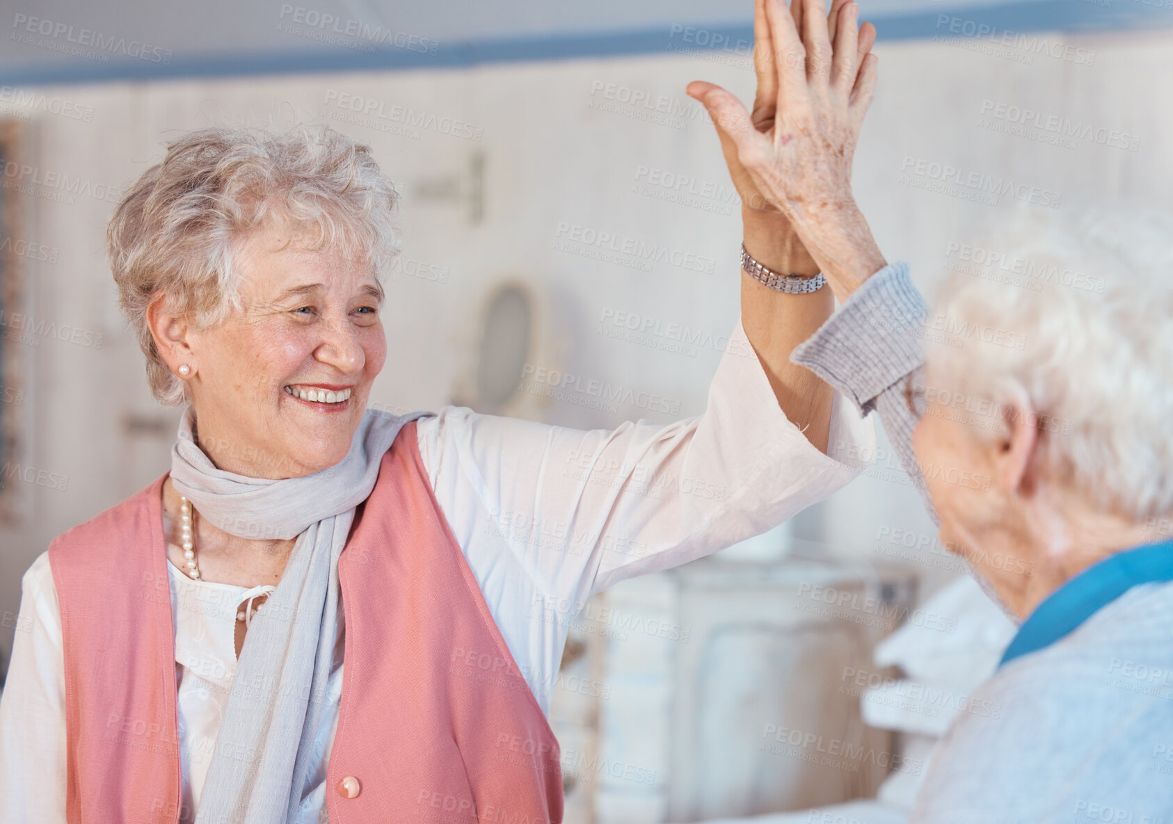 Buy stock photo Senior women, high five and friends happy, celebration and happy together in retirement house, partnership and support. Elderly female, motivation and goal with happy smile in old age home or excited