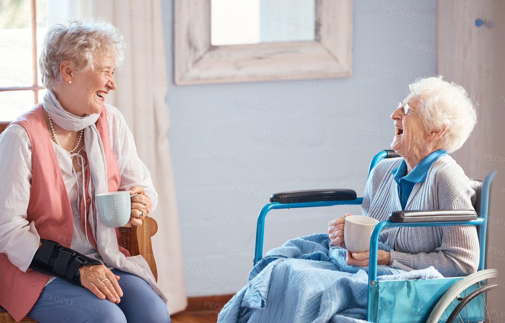 Buy stock photo Coffee, senior women and friends laugh for funny story with trust, love and care. Elderly women, wheelchair and disabled female with conversation, happy smile and bonding together in retirement home