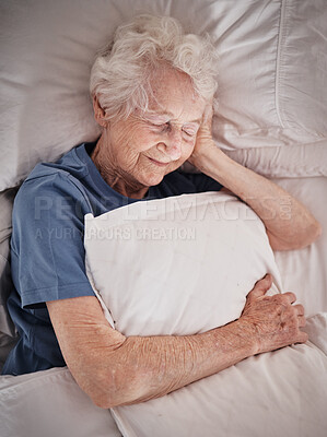 Buy stock photo Relax, bedroom and old woman sleeping in peace resting in a house or home dreaming with a soft pillow in hand. Bedding, healthy grandmother or tired elderly person in retirement enjoys napping alone 