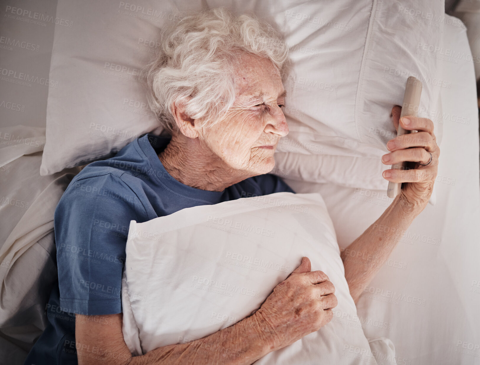 Buy stock photo Bad vision, senior woman and phone on bed in bedroom home texting, social media or internet browsing. Blurred eyesight, retired and elderly female with smartphone squinting and trying to read message