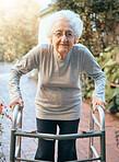 Portrait, old woman and walking frame at park for healthcare, wellness and healthy sunshine. Freedom, retirement and elderly female with disability outdoors in nature or garden for fresh air alone.
