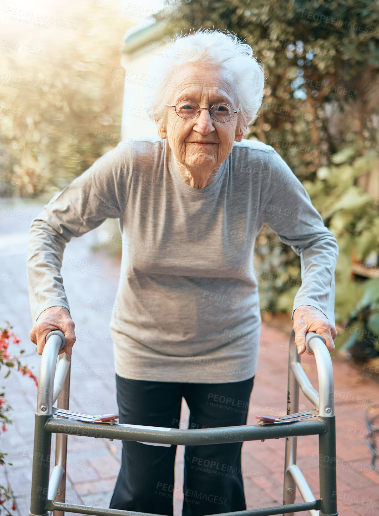 Buy stock photo Portrait, old woman and walking frame at park for healthcare, wellness and healthy sunshine. Freedom, retirement and elderly female with disability outdoors in nature or garden for fresh air alone.
