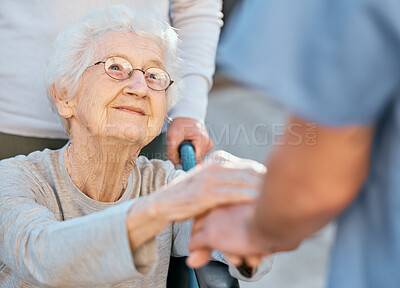 Buy stock photo Holding hands, caregiver and senior woman in wheelchair for support outdoor in retirement home. Love, trust and healthcare nurse or medical wellness doctor for disability patient with kindness