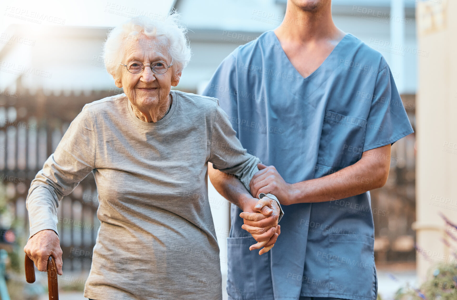 Buy stock photo Elderly, woman and nursing home, caregiver and holding hands with healthcare for the old and support. Rehabilitation,  help with care portrait and physical therapy with nurse and patient outdoor.