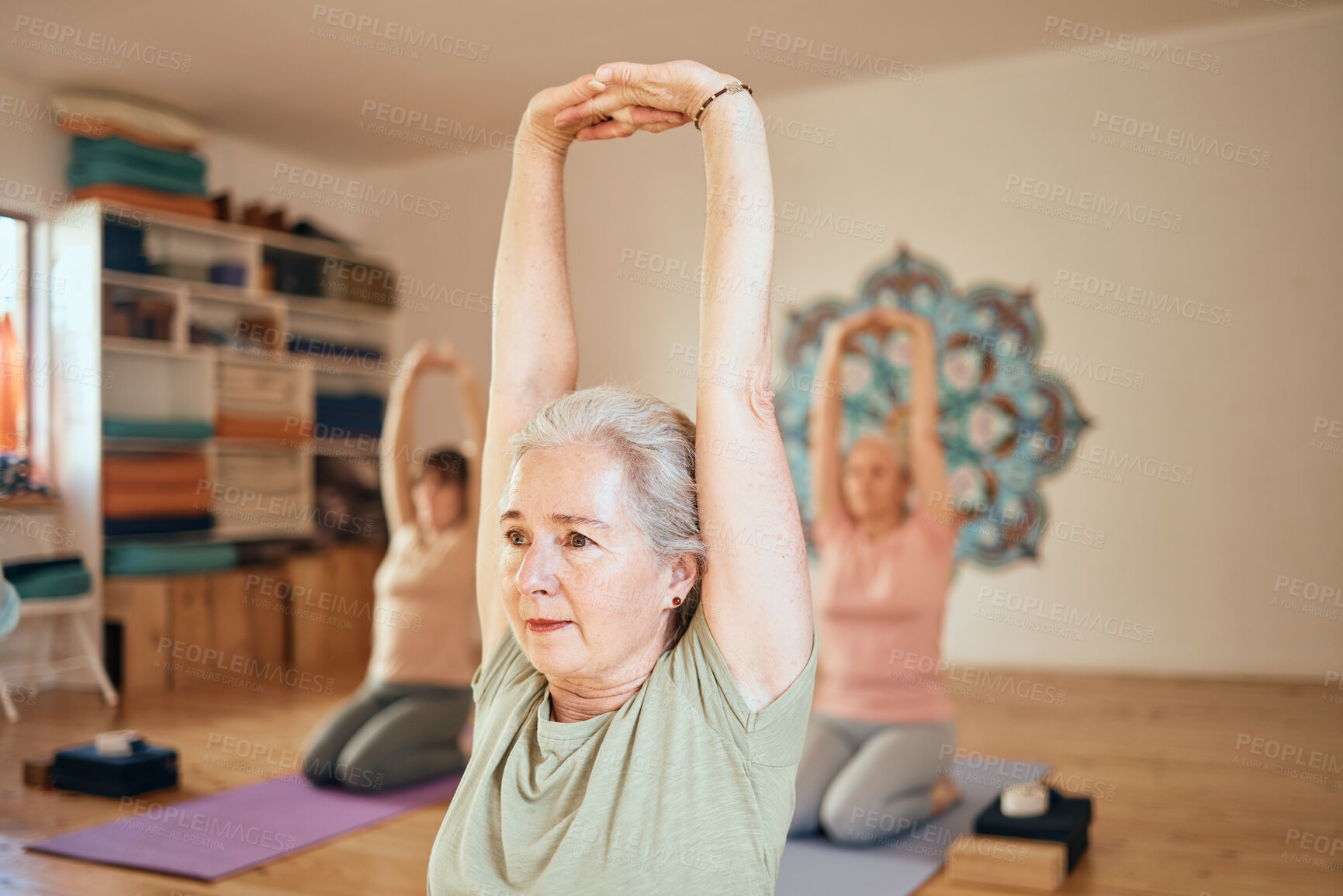 Buy stock photo Yoga, fitness and senior woman in studio doing workout, stretching and training in exercise class. Wellness, retirement and active elderly female doing pilates, exercising and balance in gym lesson