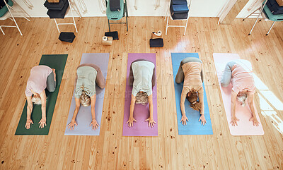 Buy stock photo Yoga, studio and group of senior women in retirement doing a stretching exercise for body and mind. Wellness, health and elderly friends doing pilates workout for balance, peace and fitness in class.