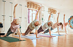 Senior yoga, workout class in a gym studio with pilates, exercise and fitness women friends. Retirement home health, wellness and zen training in healthy body elderly activity for mindfulness balance