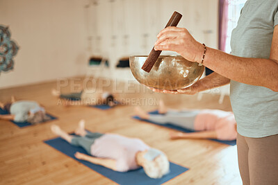 Buy stock photo Yoga, class and woman with Tibetan singing bowl for meditation, calm and mindfulness in yoga class. Zen, wellness training and female trainer with copper bowl for spiritual healing exercise in studio