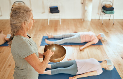 Buy stock photo Sound bowl, women healing and healer with senior class for music therapy meditation, alternative medicine or audio holistic healthcare. Yoga, chakra and reiki energy support for relax people on floor