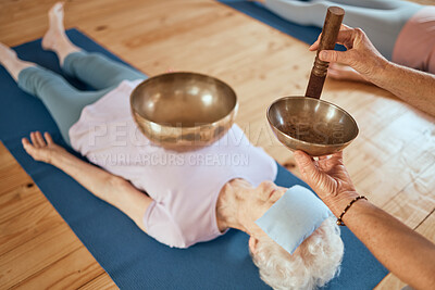 Buy stock photo Singing bowls, meditation and senior woman on floor for healing, vibration and sound therapy with healer. Sound healing, zen and elderly lady on a ground for tibetan bowl music, relax and wellness