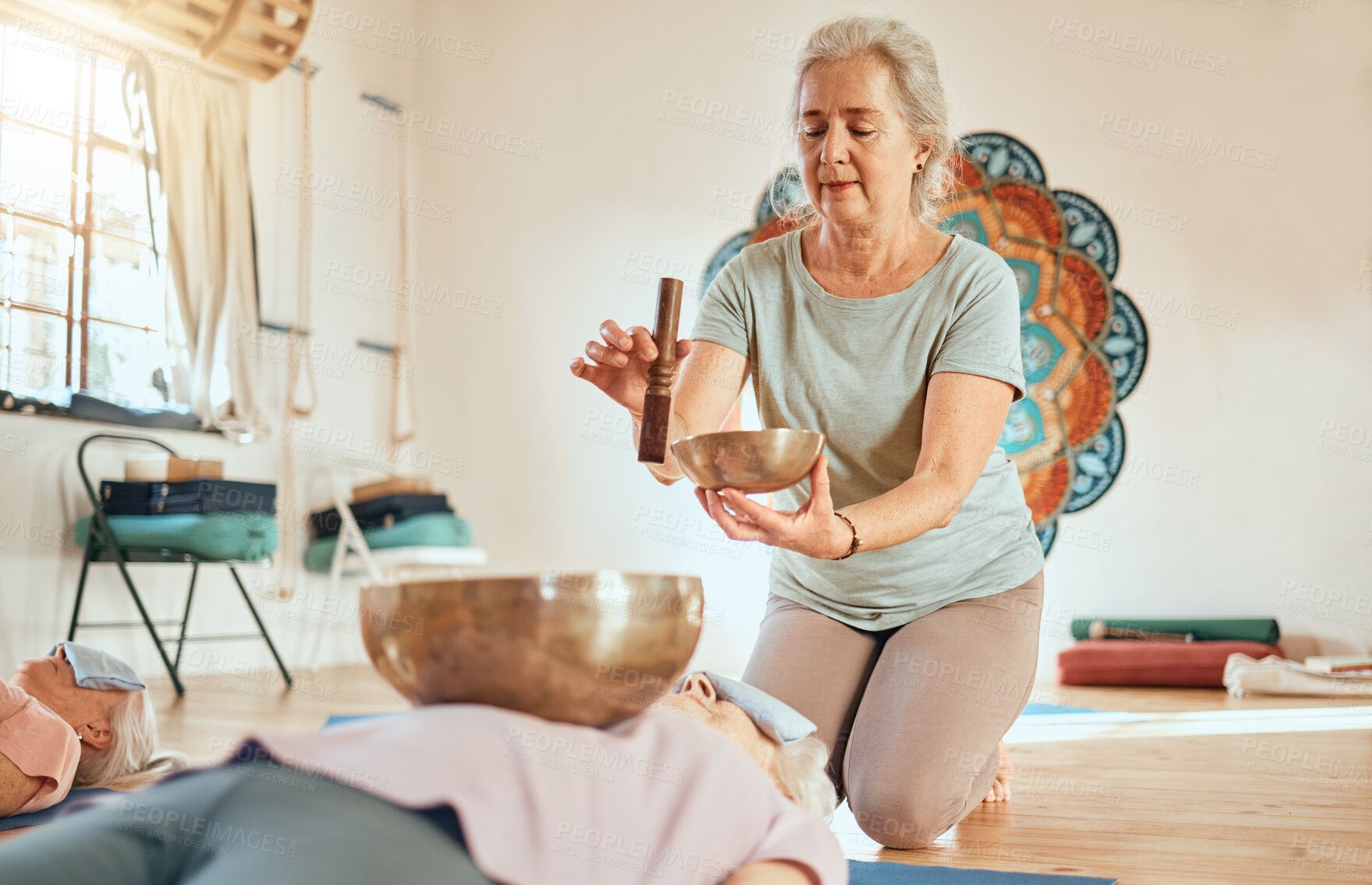 Buy stock photo Meditation, tibetan bowl and zen senior women doing a sound healing or therapy practice in a studio. Peace, calm and elderly friends with a singing bowl for body and mind wellness, health and balance