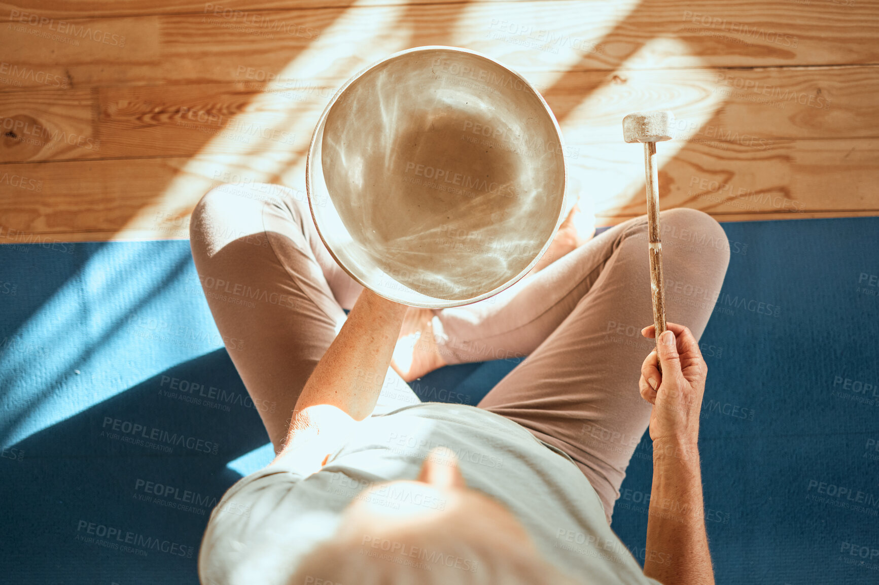 Buy stock photo Yoga, wellness and meditation sound therapy of a senior woman doing zen, spiritual and calm workout. Above view of meditate, fitness and mindfulness exercise training on the living room ground