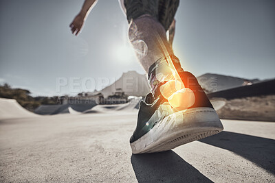 Buy stock photo Muscle pain, injury and leg of a skater at a park for exercise, sports and urban cardio. Fitness, training and x ray lighting of the bone and anatomy in the foot of a person skating in the city