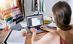 Fashion, clothes and digital designer woman working on a computer planning clothing production. Online, web and textile design of a seamstress, tailor and stylist employee in a creative work studio