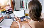 Laptop, planning and schedule with a woman designer working in her office on creative fashion for retail. Computer, calendar and ecommerce with a female seamtress or tailor at work on design