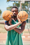 Black man, basketball player and balls in fitness game, exercise match or training competition. Portrait, basketball court and sports athlete with wellness motivation, health goals and winner mindset