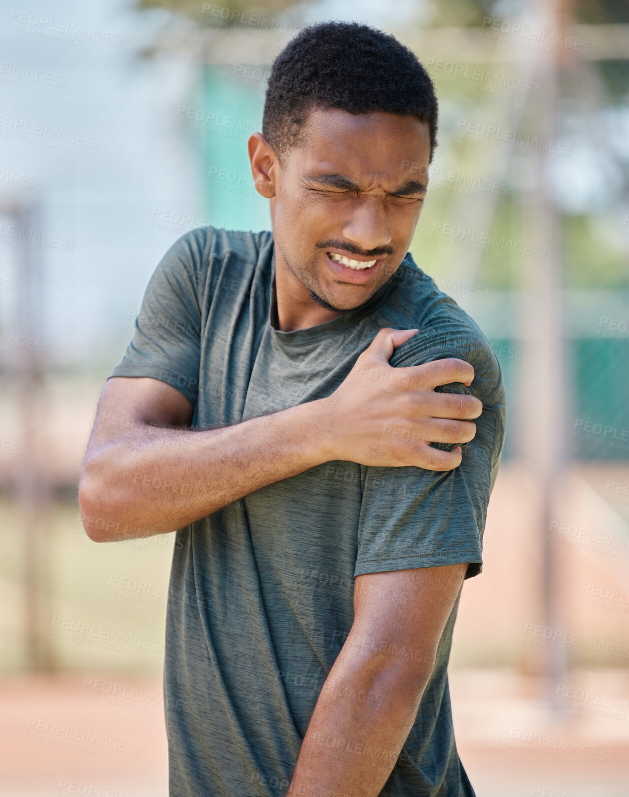 Buy stock photo Fitness, man and shoulder pain by runner after exercise, training and morning run in city on blurred background. Arm injury, sport and athletic guy suffering from muscle, arthritis or cardio distress