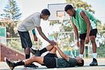 Basketball, knee injury and sport accident with team help and support in a sports competition. Fitness, workout and basketball court emergency in a exercise game with athlete on the ground in pain