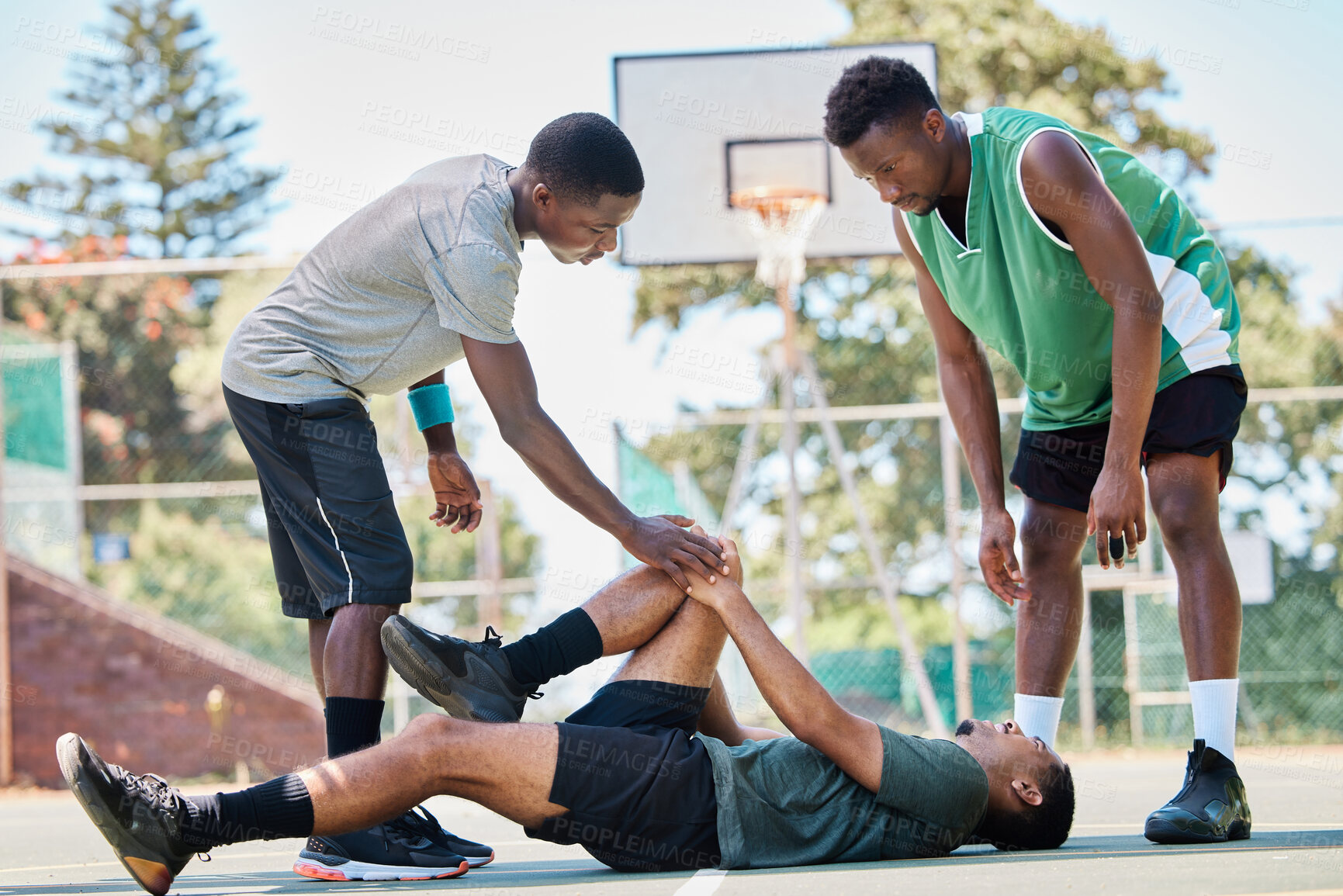 Buy stock photo Basketball, knee injury and sport accident with team help and support in a sports competition. Fitness, workout and basketball court emergency in a exercise game with athlete on the ground in pain