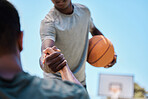 Basketball, help and team on a court playing a match, training or practicing together for a competition. Fitness, sports and man helping his friend on a basketball court during a game or practice.