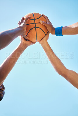 Buy stock photo Teamwork, sports and hands on basketball ball with blue sky background in outdoor basketball court. Support, community and athletes ready for game, match and training for fitness and exercise in park